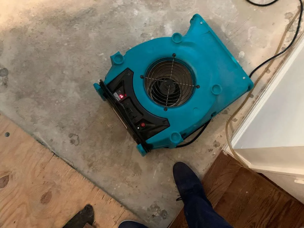 Air mover drying subfloor during Leak Detection & Repair in Haverhill